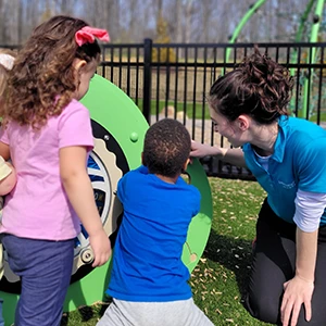 Learning Paths Academy teacher with students learning outside - example of daycare careers