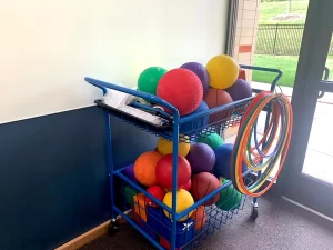 Learning Paths Academy South Campus Cart of balls and hula hoops