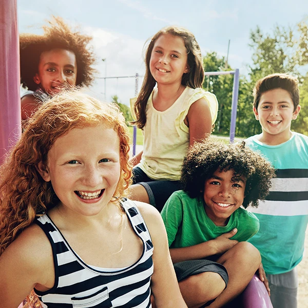 Learning Paths Academy Youth Zone - school age care program - photo of pre-teen children on playground together