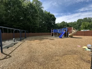 Playground mulch area with swings and slides at Learning Paths Academy Ashland