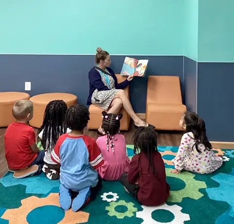 Teacher reading with students at Learning Paths Academy